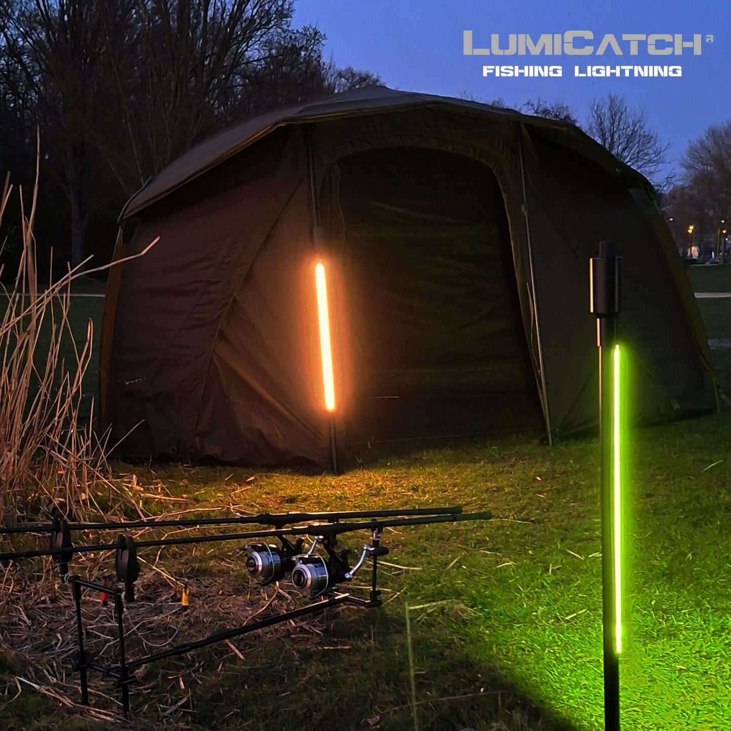 LumiCatch BuzzOff outdoor light beside fishing tent, illuminating area with mosquito-repelling green light.